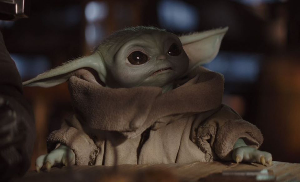 The meme is an image of the character Baby Yoda from the TV show "The Mandalorian" with a caption "When you're trying to work but you just can't focus". The image shows Baby Yoda sitting at a desk, looking adorable but also slightly annoyed, as if he's trying to concentrate on his work but keeps getting distracted.